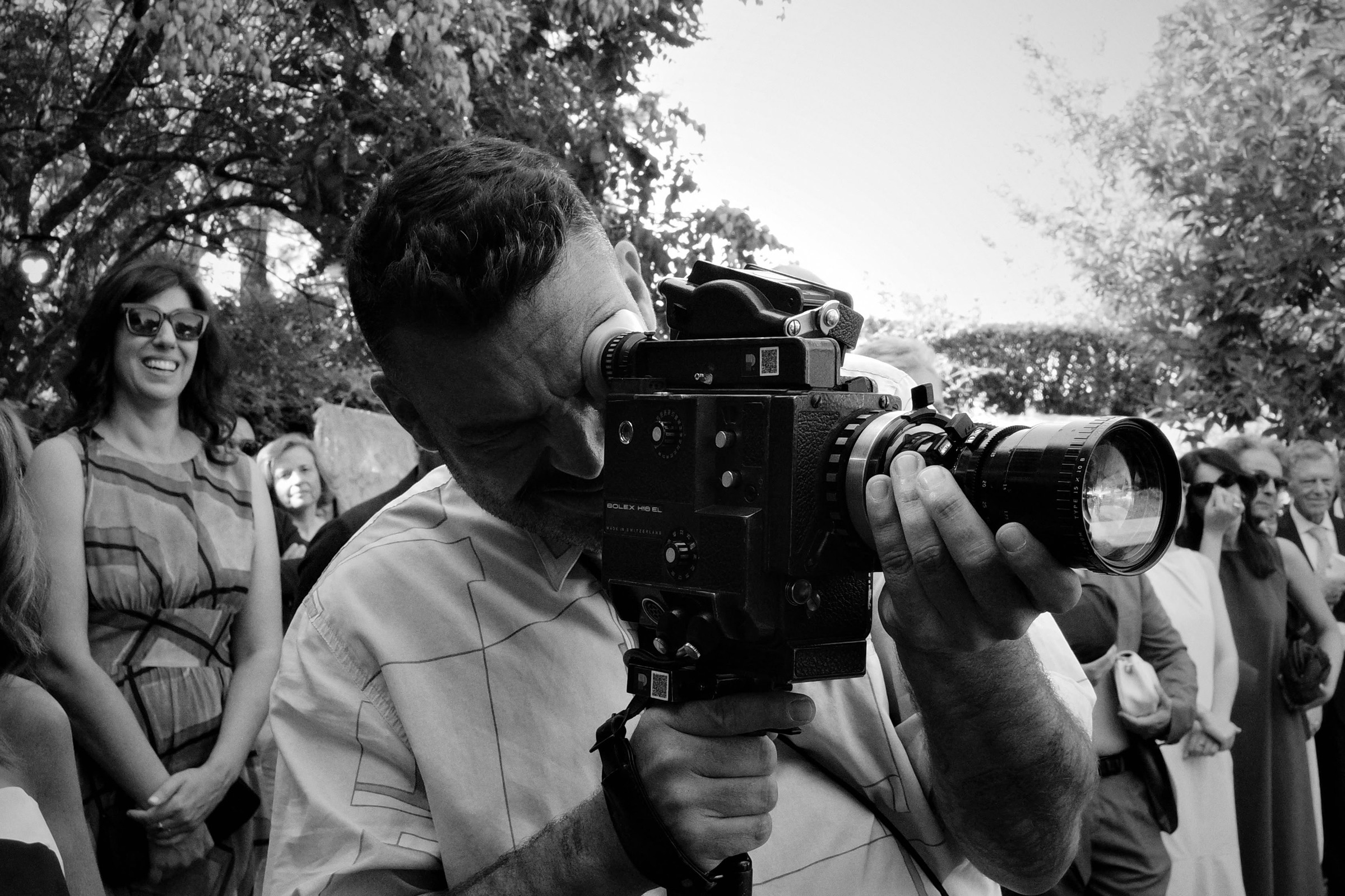 Richard Coelho working with a camera on location